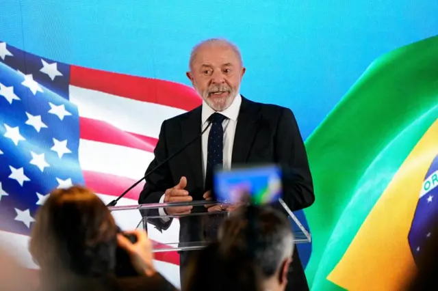 President Lula of Brazil against a backdrop of US and Brazilian flags