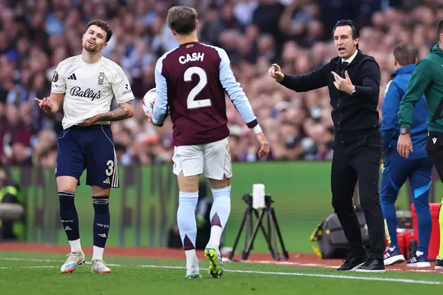 Emery gives instructions to Cash before he takes a throw in