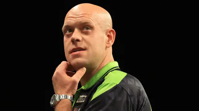 Michael van Gerwen reacts during his match against Luke Littler on night fourteen of the BetMGM Premier League 2026 at First Direct Bank, Leeds
