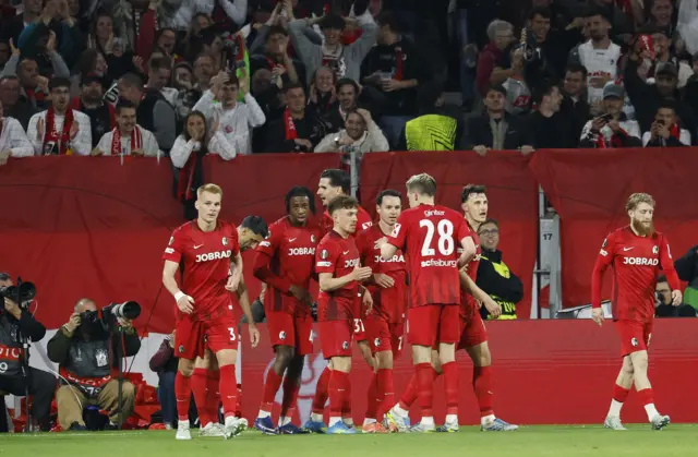 Freiburg celebrate a goal during the first half