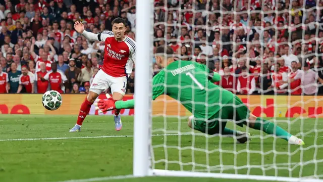 PSG keeper Gianluigi Donnarumma saves from Arsenal Gabriel Martinelli in the Champions League semi-final