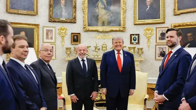 Trump and Lula pose for a photo in the Oval Office alongside their cabinet members