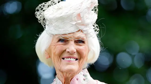 Dame Mary Berry in a pink hat and jacket