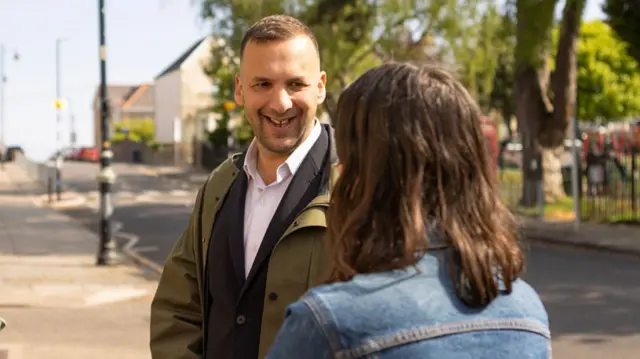 Zack Polanski, Leader of the Green Party, talking outside of a polling station at St Augustine's Parish Hall on May 7, 2026 in Penarth, Wales.