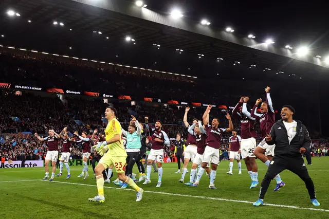 Villa players run to celebrate in front of the Holte End