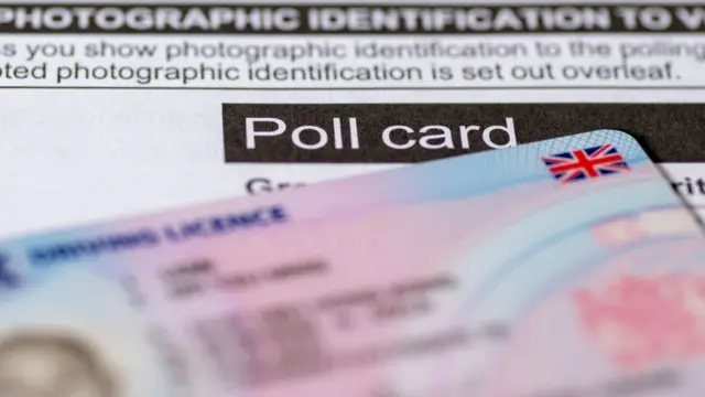 An official poll card for government elections and a UK photo driving licence as prove of identity.