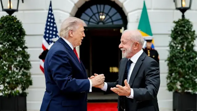 Trump and Lula shake hands outside the White House