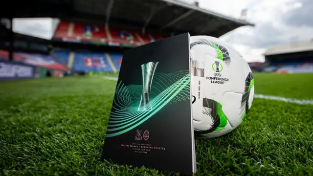 A general view of the match ball and programme in the stadium