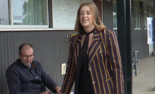Jane Dodds wearing a yellow, red and navy blazer