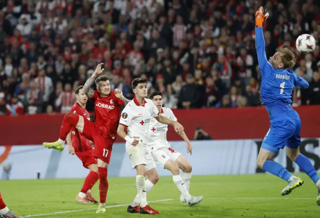Kubler scores a third for Freiburg, looping a finish over the keeper