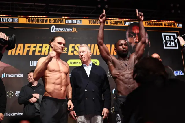 Jack Rafferty and Ekow Essuman  are shirtless and holding up their arms