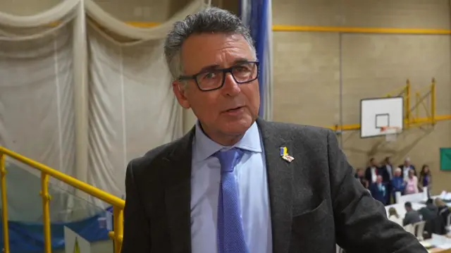 Bernard Jenkin speaking at Clacton Leisure Centre. A count is going on behind him