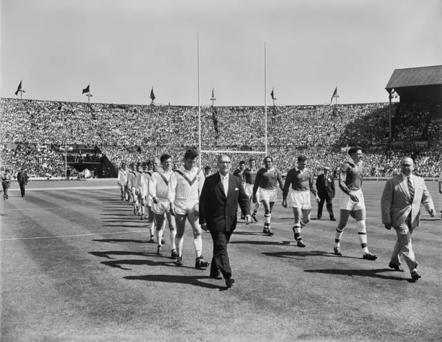 St Helens and Wigan teams walk out onto the Wembley pitch in 1961