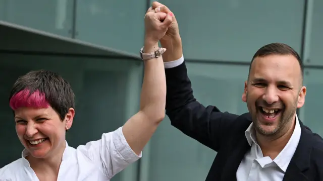 Zack Polanski celebrates with the Green Party's Zoe Garbett, who has been elected mayor of Hackney,