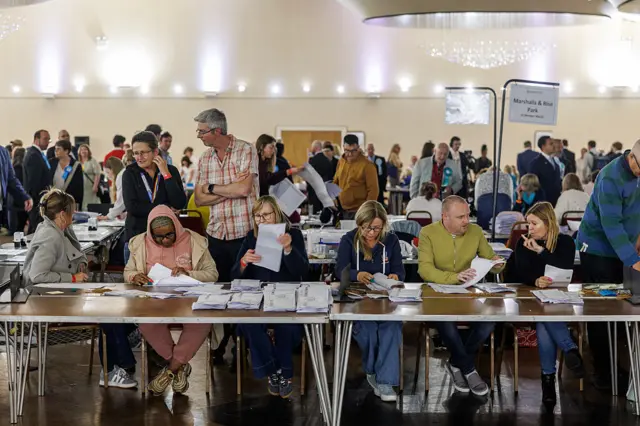 Election staff count votes during the Havering local council election