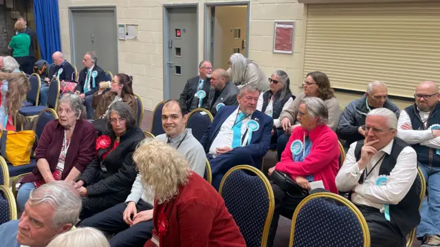 Candidates sat on chairs at the count at STEAM museum in Swindon.