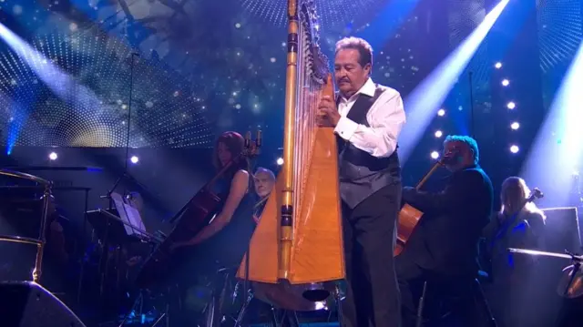 Francisco Yglesia performs on the Paraguayan harp