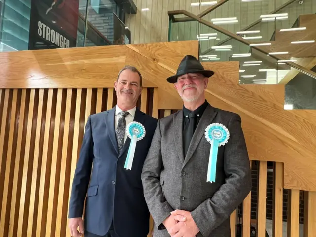 Men wearing Reform rosettes