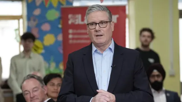 Sir Keir Starmer addresses a room full of people