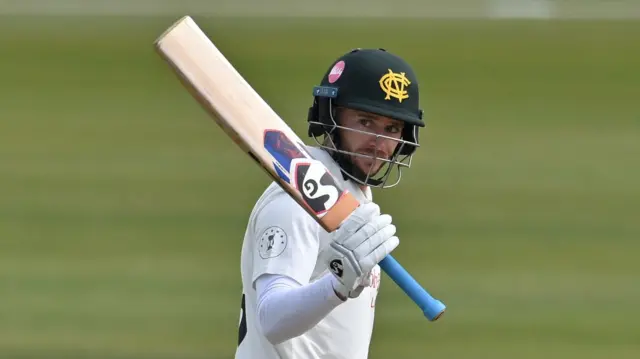 Nottinghamshire's Joe Clarke raises his bat