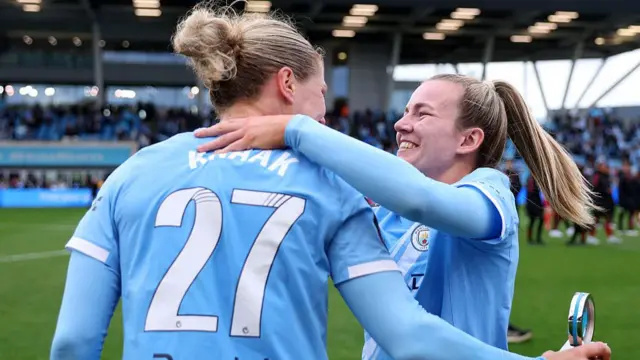 Lauren Hemp celebrates with Rebecca Knaak