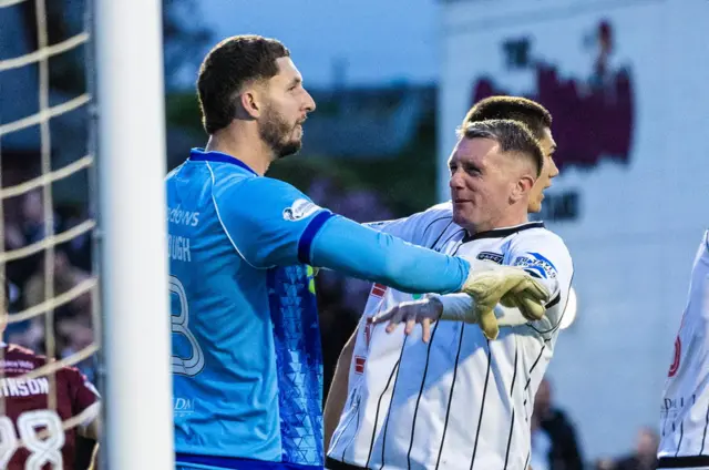 Dunfermline's Aston Oxborough (L) celebrates with Callumn Morrison after saving Aaron Muirhead's penalty