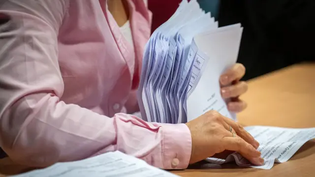 A woman verifies ballot papers at Venue Cymru on May 8, 2026 in Llandudno, Wales