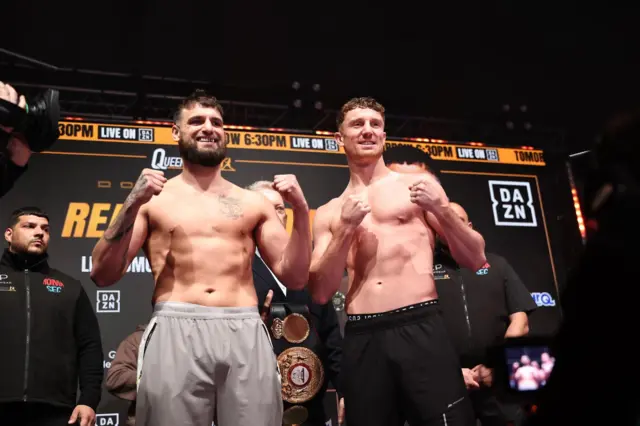 Liam Cameron and Bradley Rea are shirtless and holding up their fists
