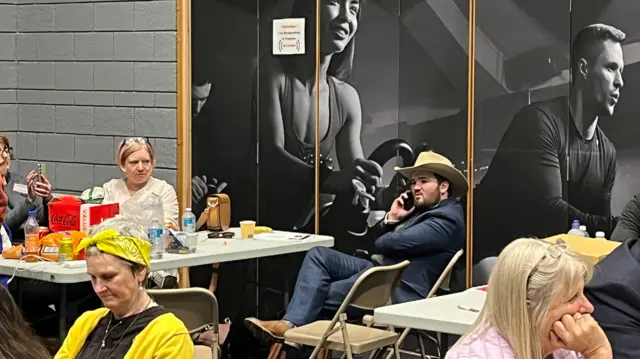 Tired looking activists at an election count