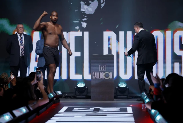 Daniel Dubois walks onto the stage for a weigh-in