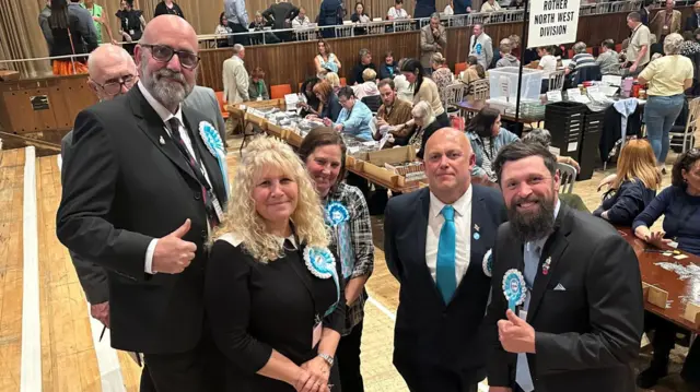 Five new Reform UK councillors posing for a picture at an election count