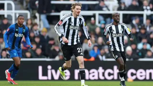 Nick Woltemade and Yoane Wissa of Newcastle United on the field togethe
