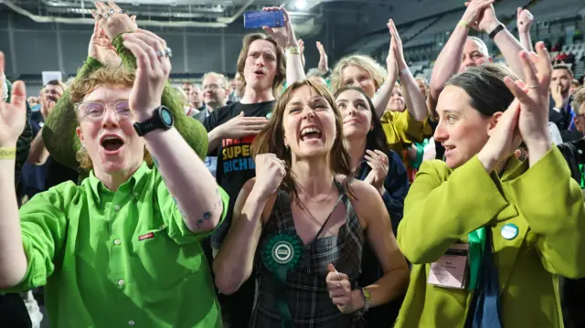 Scottish Greens candidate Holly Bruce celebrates her victory in Glasgow Southside surrounded by Green supporters