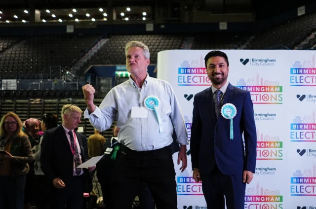 Reform UK candidates Chris Steele and Rajbir Singh celebrate