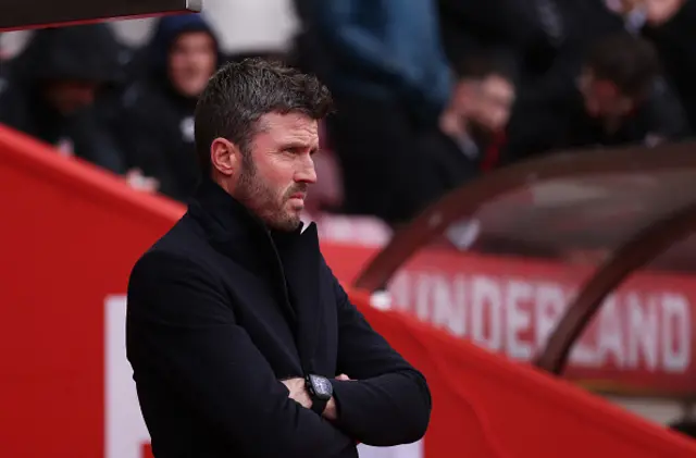 Michael Carrick, Manager of Manchester United, looks on