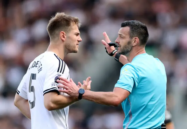 Fulham's Joachim Andersen remonstrates with referee Andy Madley after he is shown a red card