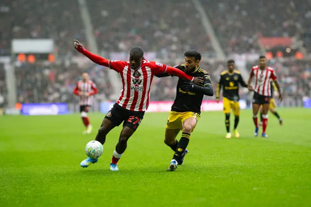 Noussair Mazraoui of Manchester United challenges Noah Sadiki