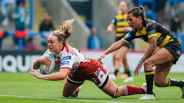 Wigan's Mary Coleman dives over to score her second try of the game against York