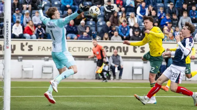 Hibs' Josh Campbell (centre) scores his second goal