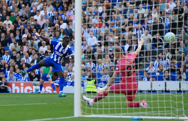 Yankuba Minteh scores their third goal past Wolverhampton Wanderers' Dan Bentley