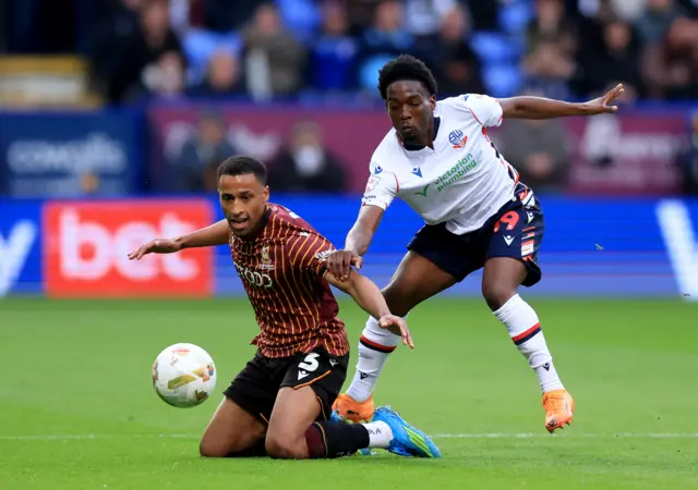 Bradford City's Ibou Touray (left) and Bolton Wanderers' Amario Cozier-Duberry battle for the ball