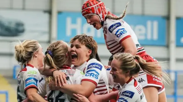 Wigan Warriors player celebrate a try in their women's Challenge Cup semi-final win against York