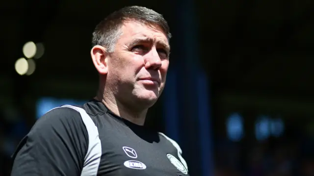 Dave Challinor watches Stockport warming-up