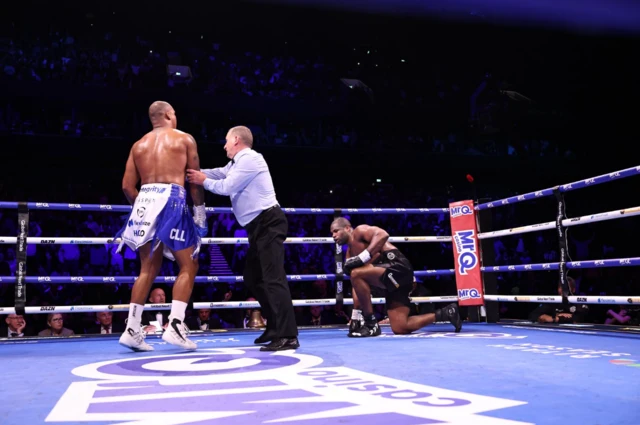Fabio Wardley is pushed away by referee with Daniel Dubois on the canvas