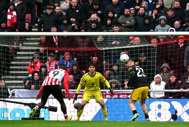 Luke Shaw (R) saves from a shot by Sunderland's Dutch striker #09 Brian Brobbey