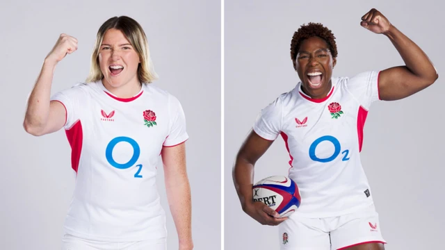 Haidee Head, wearing a white England shirt and with a short blonde bob, poses with her right fist raised (left). On the right, Christiana Balogun, wearing a white England kit, holds a white ball with red and blue edges under her right arm and raises her left fist above her head