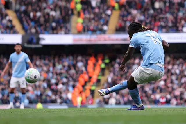 Jeremy Doku of Manchester City scores his team's first goal