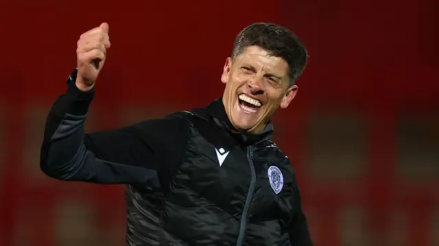 Alex Revell smiles and gives the thumbs up to Boro fans