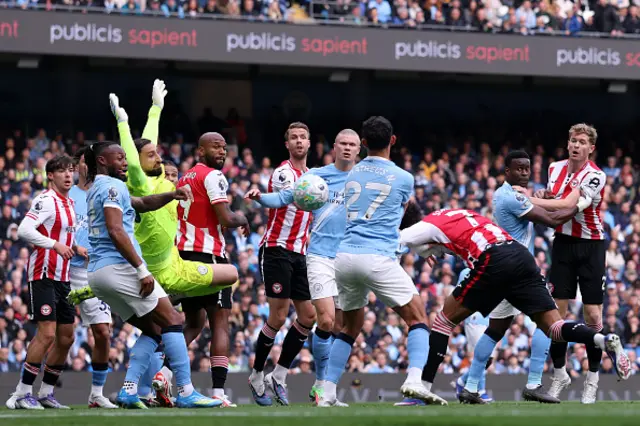 Kevin Schade of Brentford shoots which is saved by Gianluigi Donnarumma of Manchester City