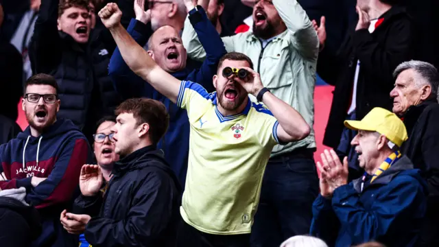 Southampton fan with a pair of binoculars